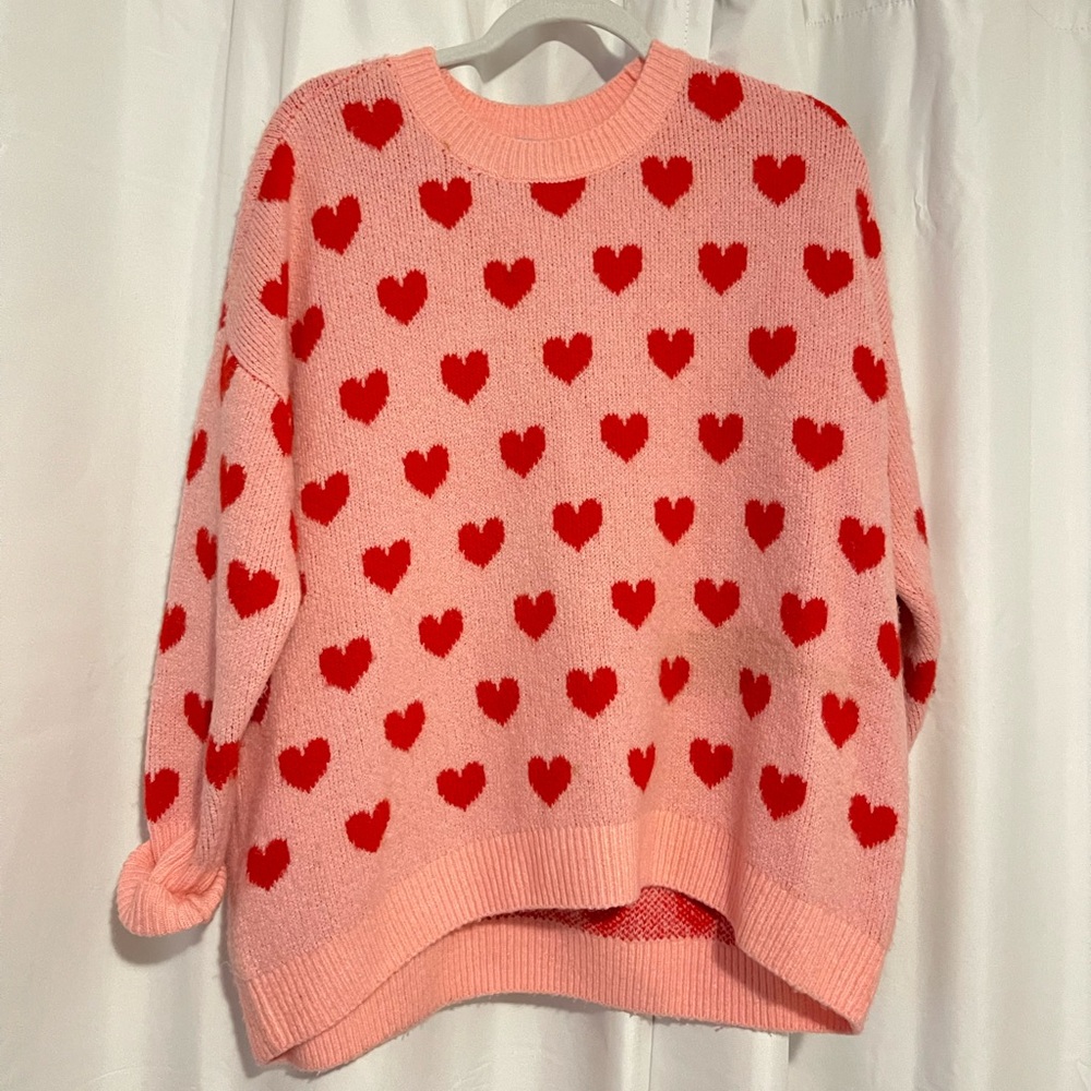 Pink and red sweater with hearts